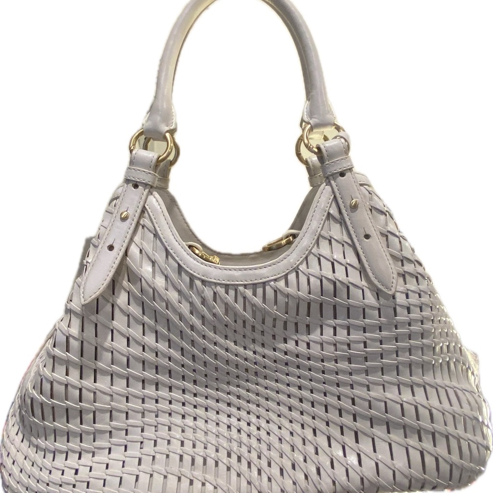Cole Haan. Stylish White Shoulder Bag with Woven Texture and Gold Hardware